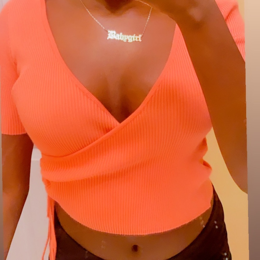 pink cropped top